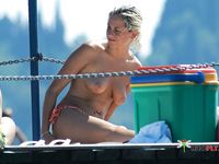 Nudist girl with thin body but fantastic big tits enjoys her time at a naked beach
