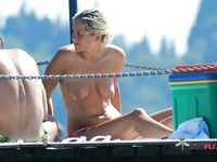 Nudist girl with thin body but fantastic big tits enjoys her time at a naked beach
