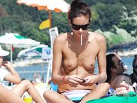 She gets caught on camera sunbathing on her stomach with her incredible, bubble ass and smooth shaved pussy on display 2