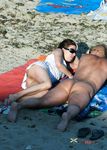 She goes around topless, showing off her breathtaking, large, natural breasts