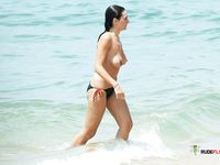 Bandy girl with big tits came to work out to the beach, but since she's from a nudist family, she took her top off and showed her breasts