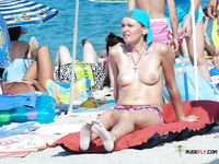 Among Fellow Naturists — A Nude Sunbather on the Sandy Beach