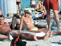 Among Fellow Naturists — A Nude Sunbather on the Sandy Beach