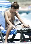She walks around and flaunts a pair of perfect, large, natural breasts before sitting down and relaxing 2