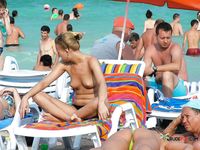 Playful nudist cuties have fun at the beach 2
