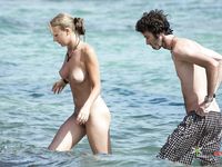 Topless slim hotties take turns showering with their perfect breasts on display 4