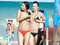 Patterned Headband and Turquoise Bottoms on a Topless Beach