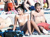 Patterned Headband and Turquoise Bottoms on a Topless Beach