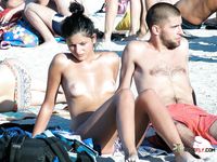 Patterned Headband and Turquoise Bottoms on a Topless Beach