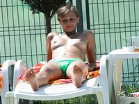 Warm Sun on a Colorful Towel With Green Bikini Bottoms
