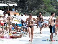 Topless Walk by the Waves in Colorful Bikini Bottoms
