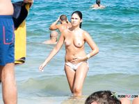 They come to a naked beach and then they enjoy themselves with her tits out, and you can see their asses as well
