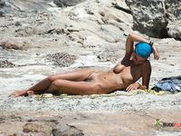 Dashing brunette gets caught on a hidden cam with her big, natural tits on display