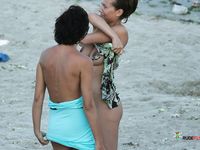 Sexy brunette comes from a nudist family, and therefore she adores lying naked at the beach while she enjoys the sun and reads her favorite magazine 2