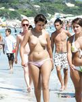 Mesmerizing girl with beautiful tits is relaxing and enjoying the sun alone in the nudist park 2
