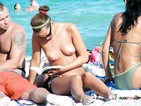 She spreads her legs and shows off her perfect, smooth pussy while sunbathing 4