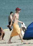 The girl is always topless, even on a regular beach, and her boyfriend doesn't mind that at all 3