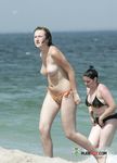 The girl is always topless, even on a regular beach, and her boyfriend doesn't mind that at all 3