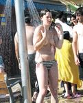 MILFs are waiting for their turn to take a shower in nudist colony while voyeur has enough time to film their curvy bodies and fat asses