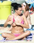 Breathtaking nudist brunettes enjoy a hot, sunny day at the beach 2