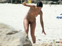 Sand-Dusted Skin on a Sunny Naturist Beach Shore
