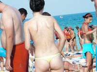 She covers her firm breasts and soft pussy in sunscreen before lying down with her ass showing 2