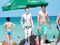 Multiple beautiful brunettes with slim bodies and perky tits fool around in the water and walk on the beach topless 3