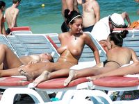 Multiple beautiful brunettes with slim bodies and perky tits fool around in the water and walk on the beach topless 3