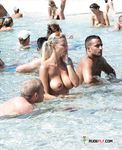 She lies down and sunbathes completely naked, with her cute, perky tits and her adorable, trimmed pussy on display 4