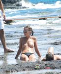 She gets filmed applying sunscreen on her slim body before showing off her perfect tits and hairy pussy 4
