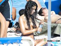 She gets filmed applying sunscreen on her slim body before showing off her perfect tits and hairy pussy 4