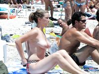 Curly brunette has her beautiful tits out while other girls also walk around topless 3