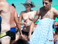 Nudist girl at a naked beach shows you her body 2