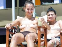 Multiple curvaceous brunettes with big tits and hairy pussies have fun in the sun