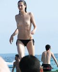 Lavish nudist redhead babe catches a voyeur filming her at the beach 2