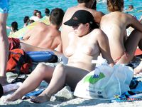 Standing Topless on the Beach in Colorful Bikini Bottoms