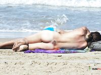 Playing in the Surf With a Star Tattoo at Her Hip