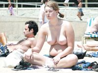 She sits on her towel and talks on the phone completely naked, with her hairy pussy and perky tits flashing 2