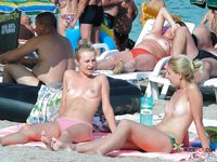 A nudist family enjoys their day at the beach