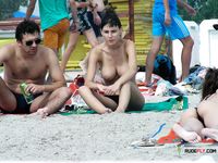 A nudist family enjoys their day at the beach