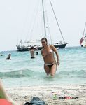 She gets caught on a hidden camera with her perfect, firm ass on display and her tiny holes barely showing