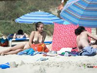 She walks around showing off her beautiful breasts before lying down and spreading legs, leaving her pussy and ass on display 2