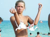 Pink Bikini Bottoms and a Topless Seat in the Sand