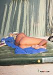They lie down sunbathing naked with their curvy asses and trimmed pussy on display 2
