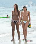 They sit or walk around talking, with their beautiful, natural breasts and firm, round asses showing completely 4