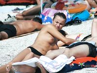 Topless and Wading Into the Water at the Beach