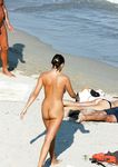 Brunette amateur stunner drops her bra and panties as she enjoys the sun on the rocks near the sea, not knowing that voyeur is filming her