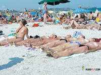 Topless on a Sandy Beach Towel Under Summer Sun