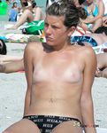 Topless on a Sandy Beach Towel Under Summer Sun