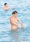Colorful Bikini Bottom in the Shallows on a Bright Beach Day